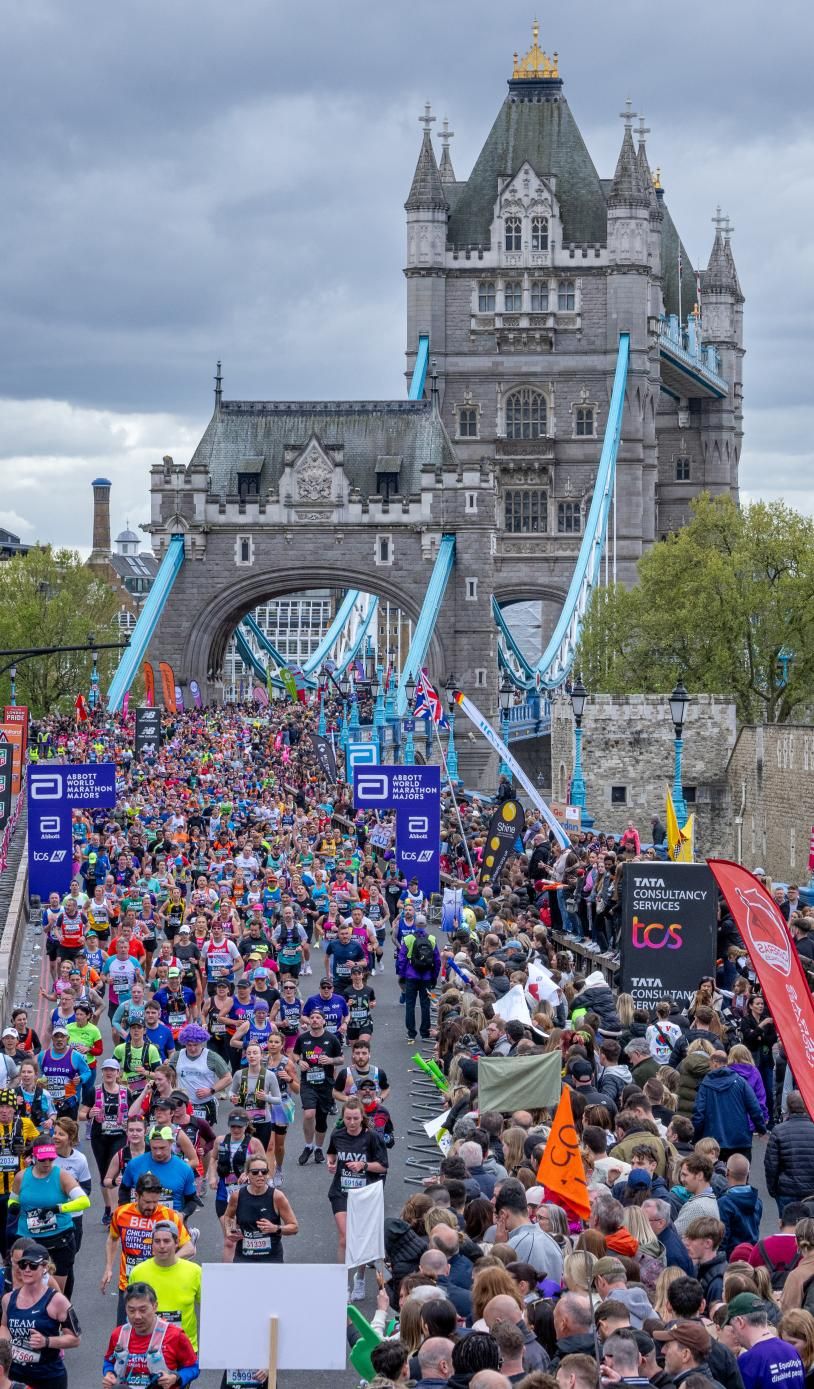 London Marathon 2025 spectators along Tower Bridge and the Thames Embankment cheering runners